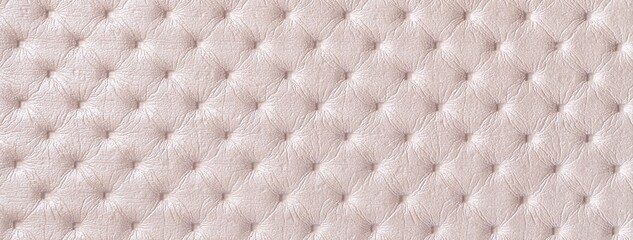 Pastel beige leather texture with capitone pattern, macro background of cream retro Chesterfield vintage textile fabric