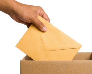 A hand is placing a yellow envelope into a cardboard box, suggesting the act of mailing or submitting documents.