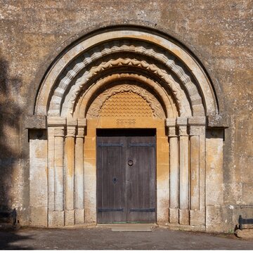 Norman doorway at Guiting Power church, Cotswolds, Gloucestershire, England