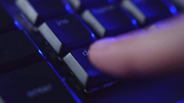 Hand Rapidly Pressing Delete Key in Frustration