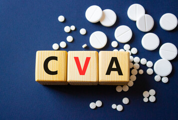 CVA symbol. Wooden cubes with words CVA Cerebrovascular accident. Beautiful deep blue background....