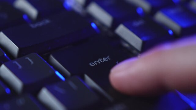 Close up of a hand rapidly pressing the enter key on a keyboard, showing urgency and pressure during computer work. Captures a decisive moment in a digital environment.