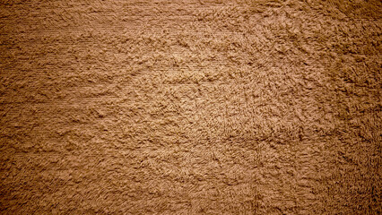 rich brown terrycloth texture closeup soft fluffy loops warm earthy tones for spa banner background or cozy wallpaper design