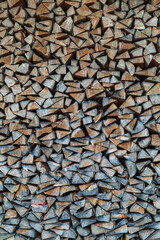 Stacked firewood texture filling the frame