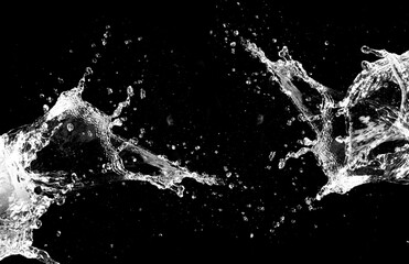 The dynamic and captivating splash of water against a black backdrop, showcasing the beauty and power of liquid