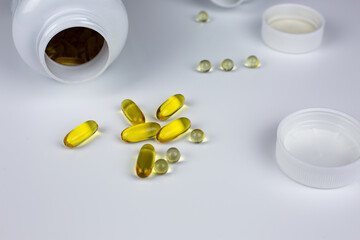 Omega 3 supplement capsules for food supplementation, round gelatin capsules of vitamin D3 with K2. Vitamins for maintaining brain and heart health. Essential vitamins for the body