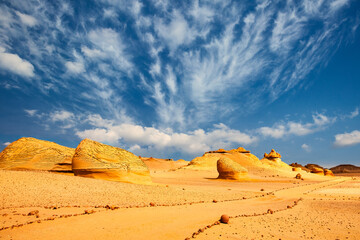 Sand and rock desert landscape with the path, Wadi Hitan, Egypt © Martin M303