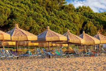Captivating sunset at Silvi Marina beach on the Adriatic coast of Italy with colorful beach chairs and scenic views, coast of the Abruzzo region.