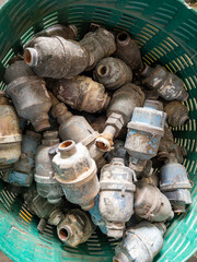 Old Brass Water Meters in Basket for Repair.