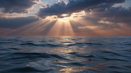 Dramatic sunbeams pierce through clouds over a calm ocean at twilight casting golden light on the water s surface