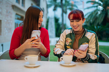 Friends enjoying coffee and sharing social media content