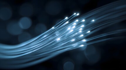 Close up of glowing blue fiber optic cables transmitting data symbolizing digital communication and technology