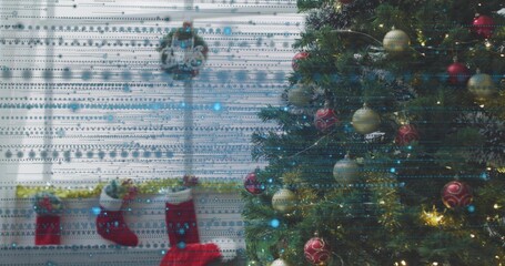 Glowing Christmas tree filling right living room, showing stockings, garland and interference