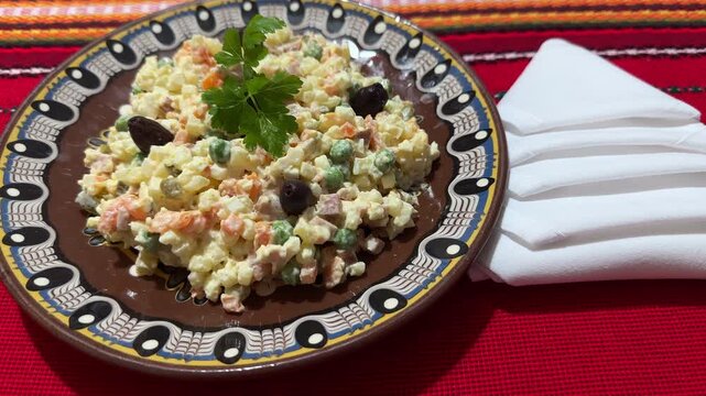 Classic Olivier Ruska Russian Salad on a Ceramic Traditional Plate, Bulgarian Serbian Cuisine