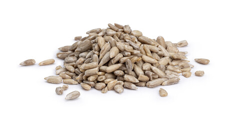 Heap of healthy peeled sunflower kernels, ready for consumption. Isolated on white background.