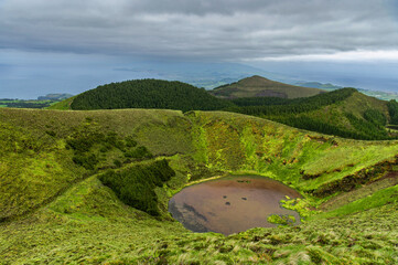 View of Volcano Lake Lagoa Rasa, Sete Cidades, Sao Miguel, Azores, Portugal. Atlantic ocean in the...