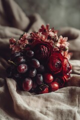 dark romantic floral and fruit arrangement with red flowers and grapes creating valentines day mood for love stories and emotional design