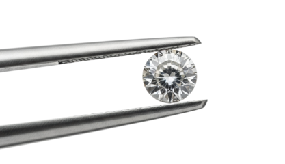 Examining a brilliant diamond with tweezers jewelry isolated on transparent background