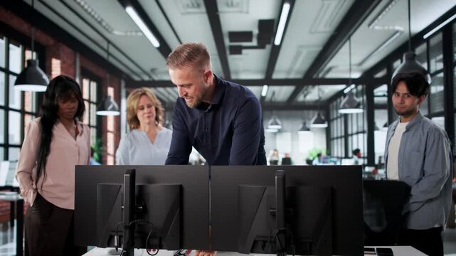 Trainer In Office Doing Desk Ergonomics Demo And Adjusting Screen