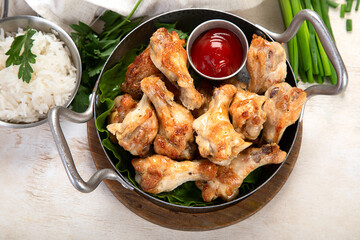 Grilled chicken wings with salt, spices and herbs.
