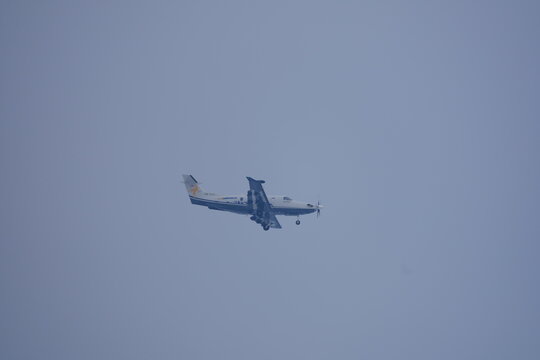 Final approach of propeller airplane Air Corviglia type Pilatus PC-12 NGX registration HB-FJJ at Swiss Z&uuml;rich Airport on a cloudy winter day. Photo taken January 6th, 2026, Zurich Oberh&ouml;ri, Switzerlan