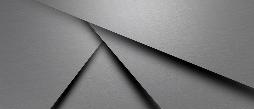 A stack of grey paper with a grey background
