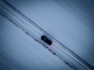 Aerial Car on Snowy Winter Road
