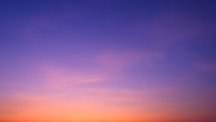Fototapeta premium Twilight Sky Background with Nature Gradient Light and Soft Pink Cloud on Colorful Orange and Blue Romantic Evening sky after Sundown