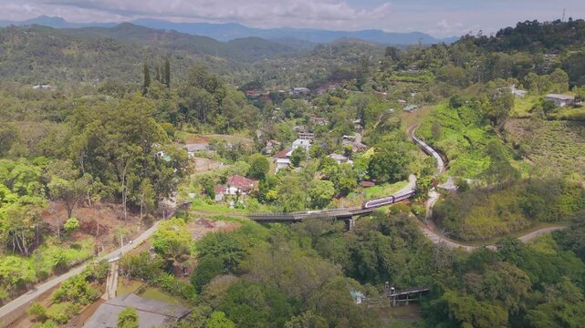 Mountain Train Curving Across Bridge in the Morning