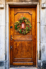 Christmas wreath and old wooden door	