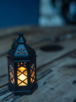 Ramadan Kareem greeting photo of beautiful Arabic lantern and flowers in the background representing the Islamic Holy Month.  
