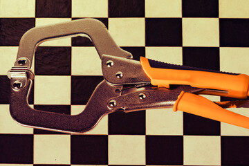 Tool for holding objects tightly in place during woodworking or metalworking tasks in a workshop environment