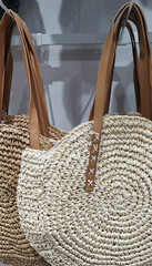 Collection of summer straw bags at the store