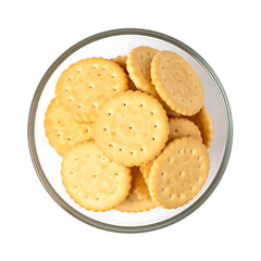 Top View of Golden Saltine Crackers in a Clear Glass Bowl