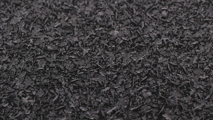 Fototapeta premium Winter natural pattern of frozen snowflakes on the trunk of a car close-up