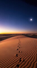 Naklejka premium Footprints in desert sand under a starry night sky, leading toward the horizon.. A captivating wide-angle view evokes mystery and adventure.. Endless possibilities, journey concept, desert landscape.