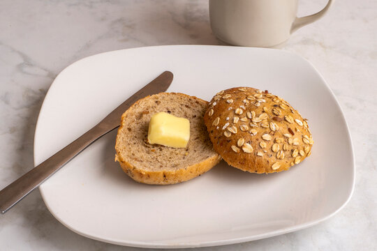 toasted multi grain bagel  with a slice of butter