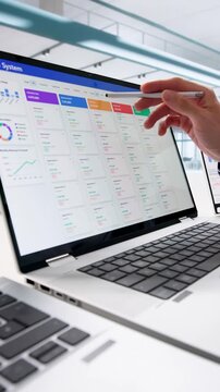 Man Using CRM Software On Laptop