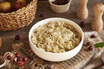 Fermented cabbage or sauerkraut in a white bowl