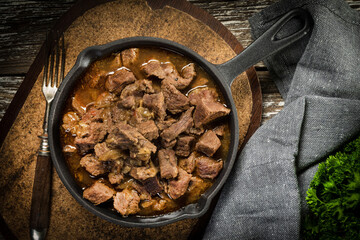 Beef stew in a cast iron skillet.