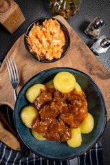 Beef stew in gravy, served with silesian dumplings.