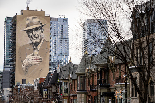 View of Leonard Cohen mural on building facade in Montreal. Montreal, Canada - December 18, 2025.