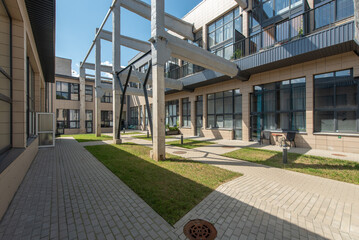 Modern Architectural Courtyard With Structural Beams and Open Space Design
