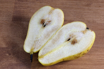 Sweet green pear, slice of ripe sweet pear.