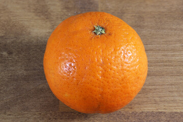 Sweet orange on a wooden table.