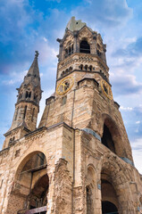 Fototapeta premium The Evangelical Lutheran church Kaiser-Wilhelm-Gedächtniskirche, colloquially known as Gedachtniskirche, is located on Breitscheidplatz. Berlin