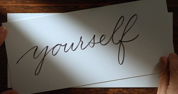 Slow Motion Close Up Of Hand  Showing Writing The Words Love Yourself With A Pen On White Paper At 1000 Fps. Concept Of Self Care, Mindfulness, Personal Growth, Calligraphy And Emotional Expression