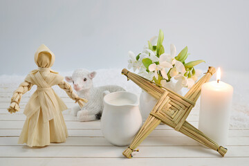 Brigid's cross, corn doll, lamb, and candle for imbolc