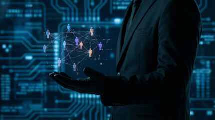 A person in a suit holds a digital representation of a network of people, symbolizing the world of hacking and cybersecurity. This scene emphasizes data safety