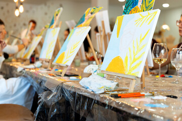 Women enjoying sip and paint art workshop